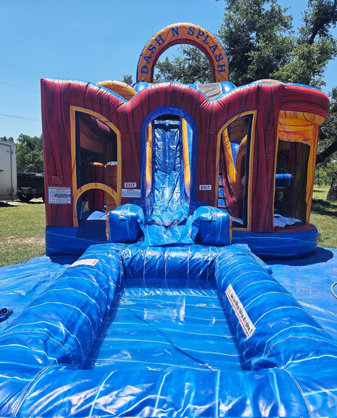 Dash N Splash fire-themed bounce house combo with slide and slip lane pool