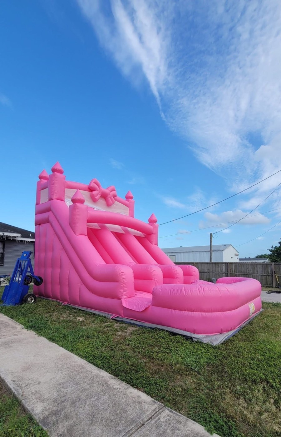 Hot pink princess castle water slide with bow and landing pool